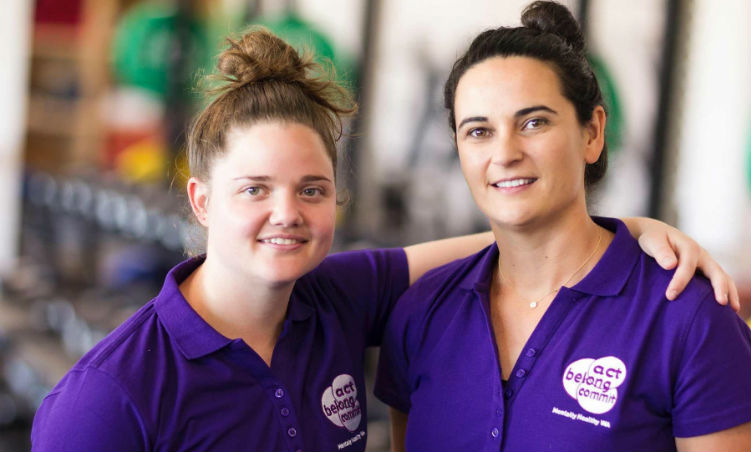 women in purple shirts