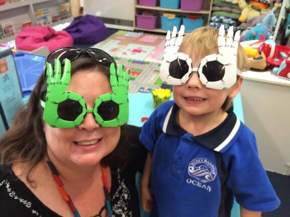 chuld and woman wearing glasses