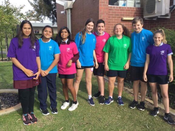 school students and teacher outdoors