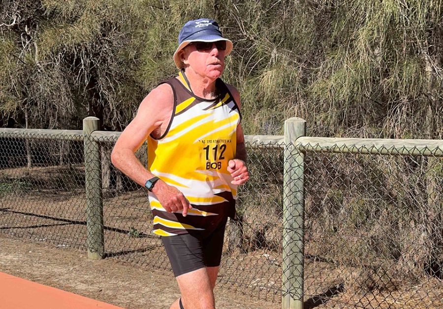 A man running on a path outdoors.