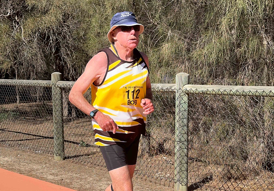 A man running on a path outdoors.